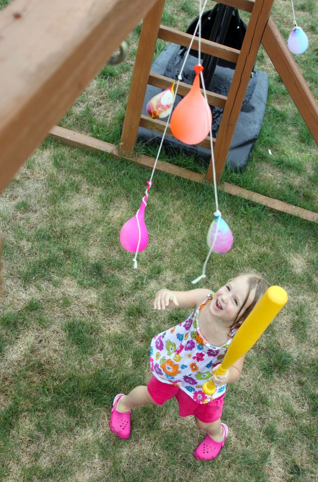 kendall batting at water balloons