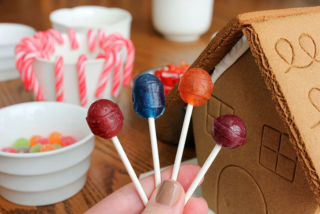 a hand of four candy suckers food groups