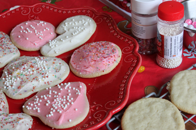 plate of pink and white sugar cookies with sprinkles